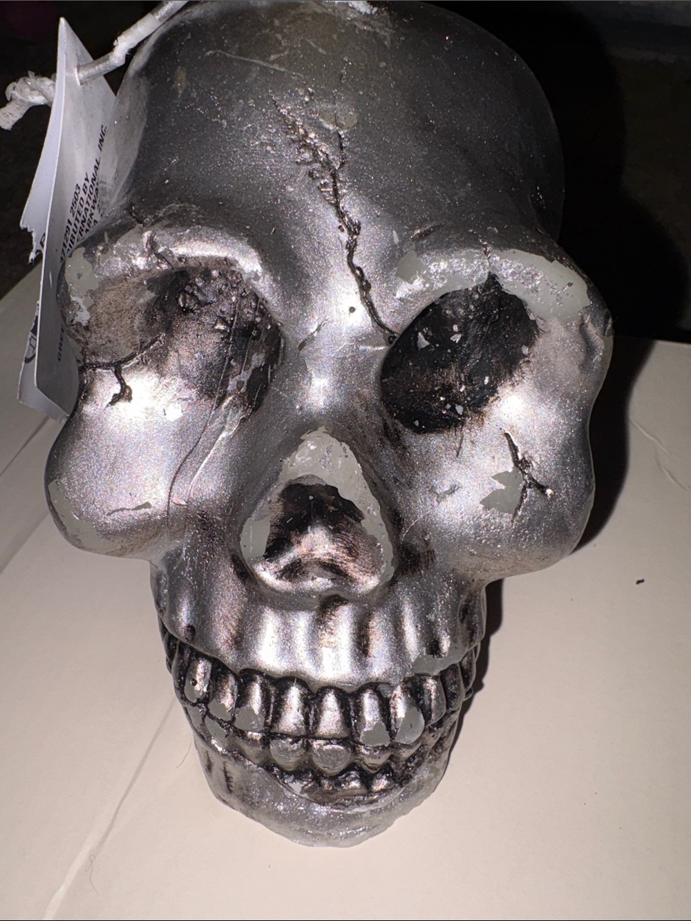 Metallic Silver Decorative Skull candle that bleeds blood